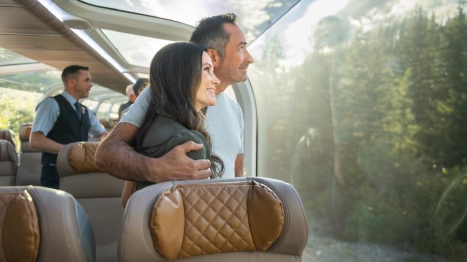 Couple looking at scenery from GoldLeaf Service coach