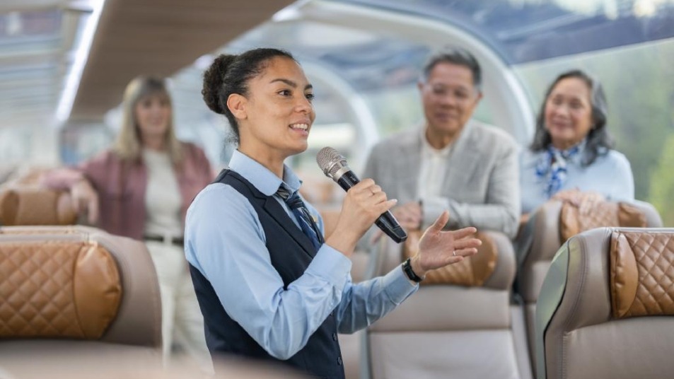 An onboard host shares her knowledge of the area