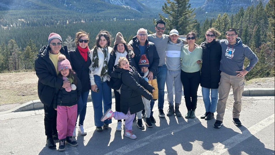 Family photo in front of mountains in the Canadian Rockies