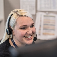 Vacation Consultant at Rocky Mountaineer assisting a guest on the phone